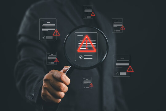 Error detection and document verification concept with magnifying glass highlighting warning alerts on digital files. Symbol of risk analysis, troubleshooting, compliance check and quality control.