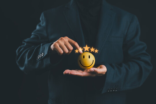 Customer satisfaction concept with smiling face and five star rating in hands, represent positive feedback, service quality, user experience, business trust, review system and client happiness