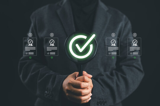 Quality and approve concept show a businesswoman holding magnifying glass with check mark representing certification standard control assurance validation and business reliability in modern industry
