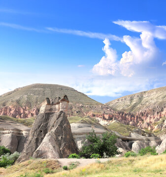 Beautiful landscape with Symbol of Cappadocia - Fairy Chimney or Multihead stone mushrooms in Pasabag Valley, Anatolia, Turkey. Topic of vacation, travel, trip abroad on vacation, cruises and tours