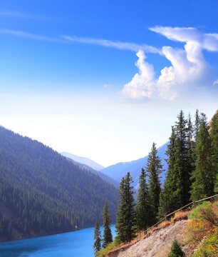 Picturesque autumn scenery of Kolsai lake, Tien Shan Mountains, Kazakhstan. Beautiful fall landscape of Alpine Kolsai lake, Almaty region. Topic of vacation, travel, leisure, adventure