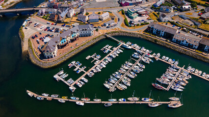 Aerial top view of marina docks filled with moored boats © Андрей Нелупов