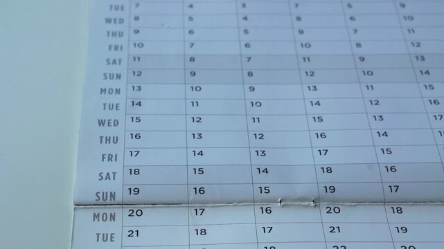 View of yearly table calendar with dates. Planning for appointments and travels for future concept.