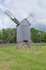 Historic wooden post mill (pukktuulik) located at Angla Windmill Park located on Saaremaa Island in Estonia in summer, Europe. © Raimo Bergroth