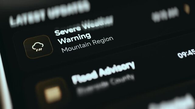 Latest updates feed with a severe weather warning and flood advisory in a government crisis center dashboard