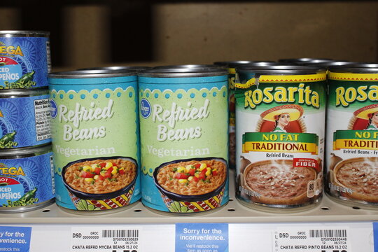 Kroger Refried Beans cans closeup shelf
