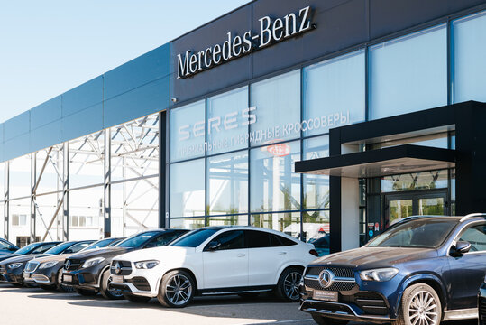 A Mercedes-Benz dealership displays several luxury vehicles outside the showroom. Customers explore the different models during the day at the location Smolensk, Russia 07.17.2026