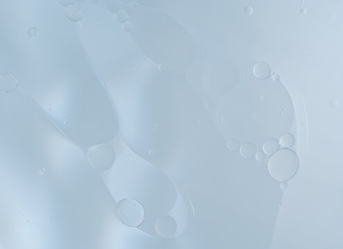 Abstract Blue water bubbles essential oil beauty collagen Serum Repair cell background.	
