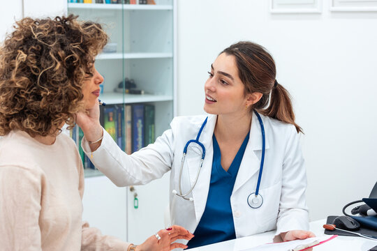 Doctor checking patient in consultation. female doctor examining woman in clinic. Healthcare and medical appointment. Patient consulting with her physician about health problems in office.