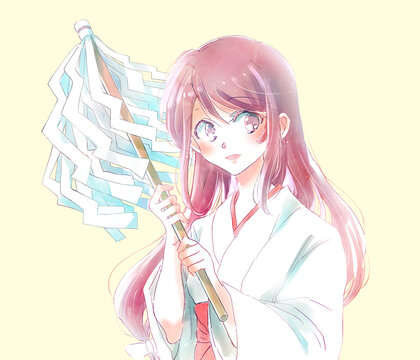 御幣を持っている巫女さん　笑顔