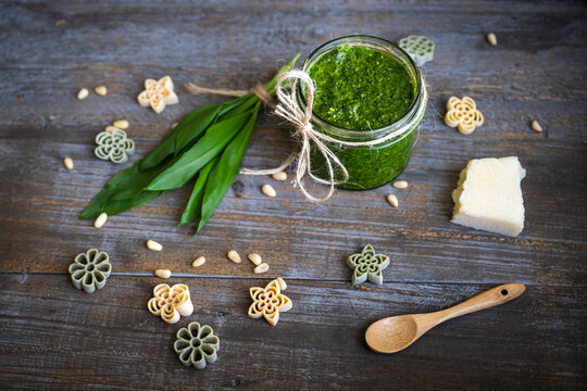 Homemade fresh wild garlic pesto with wild garlic, grano padano and pine nuts, noodels