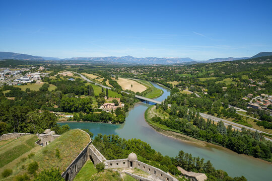 A spectacular panoramic view from the historic Citadelle de Sisteron in Provence.  The confluence of the Durance and Bu&euml;ch rivers. In the distant background, the foothills of the French Maritime Alps