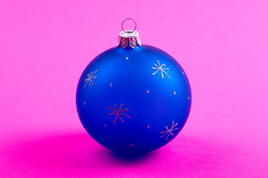 New Year's tree toy on a pink background