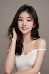 Fototapeta premium Woman in white off-shoulder strappy top smiling brightly