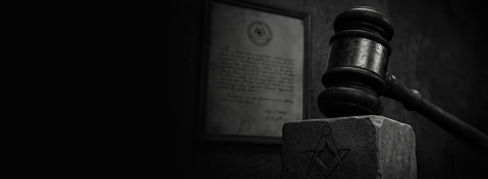 Wooden judge gavel resting on stone block engraved with masonic square and compass symbol. Background features framed certificate. Banner with copy space