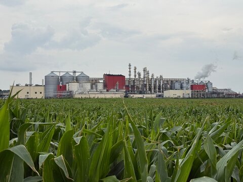 View of methanol and ethanol factory plant in corn field. Bioagra Goswinowice Ethanol Production Plant located near Nysa in Poland. Factory of bioethanol and ethanol produced from corn grain
