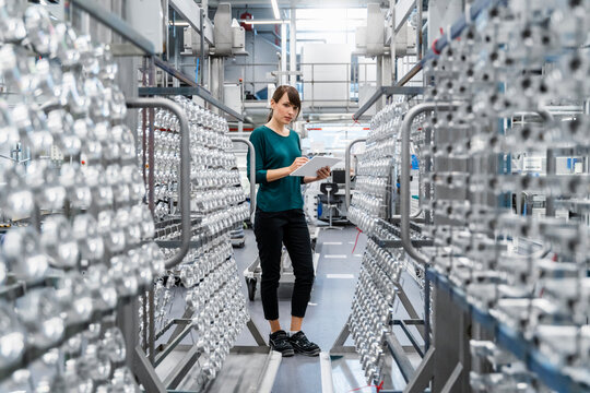 Businesswoman using tablet PC in electrical industry