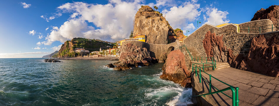 The ocean waves hit the rocky coast of Ponta do Sol in Madeira