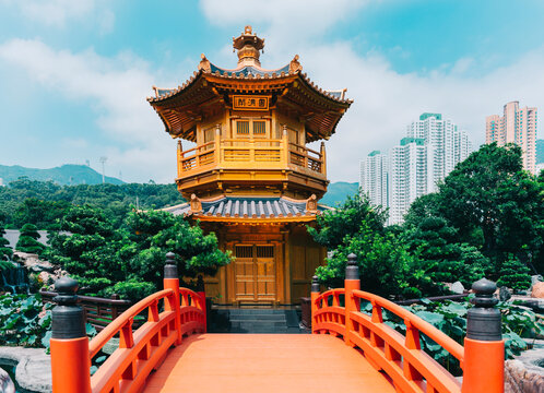 China, Hong Kong, Nan Lian Garden, Golden Pavilion of Absolute Perfection surrounded by skyscrapers