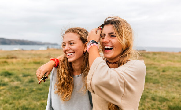Two happy teenage girls near the coast