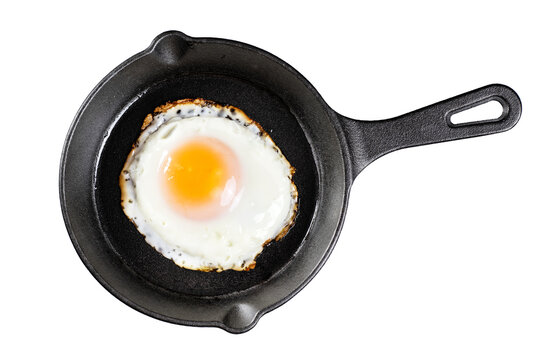 Fried egg on a cast iron mini frying pan isolated on a white background. With clipping path.