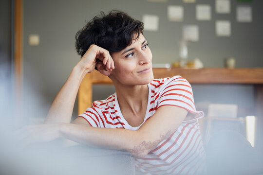 Portrait of woman at home thinking