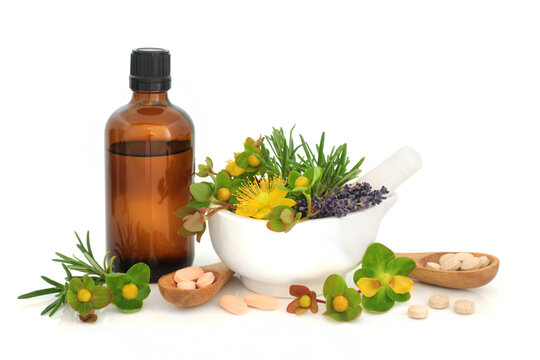 Herbs and nutritional food supplements for depression with tincture bottle, mortar on white background. Natural healing with lavender, St Johns Wort, rosemary herbs. 