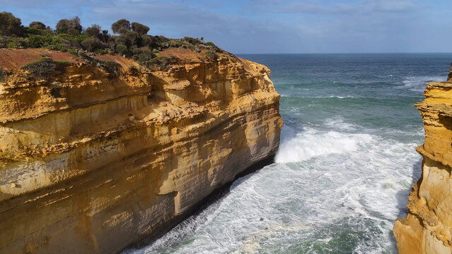 Aerial View of Loch Ard Gorge Sandstone Cliffs and Crashing Waves