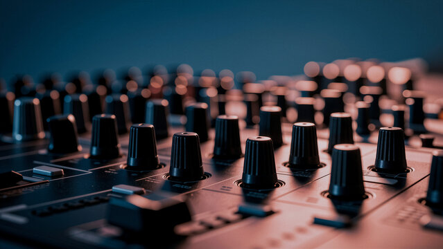 Close-up of dj mixer knobs and faders