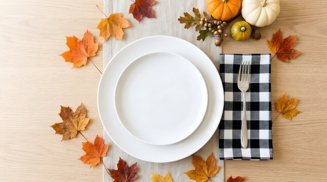 Fall table setting with empty plates and autumn leaves