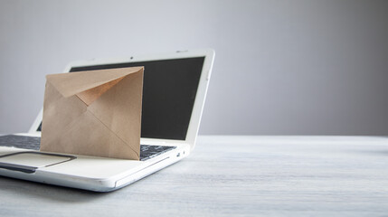 Mail envelope with a laptop computer.
