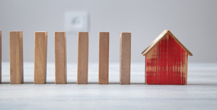 Wooden model of house with a wooden blocks.