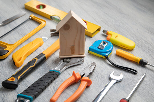 House model with a work tools on the table.