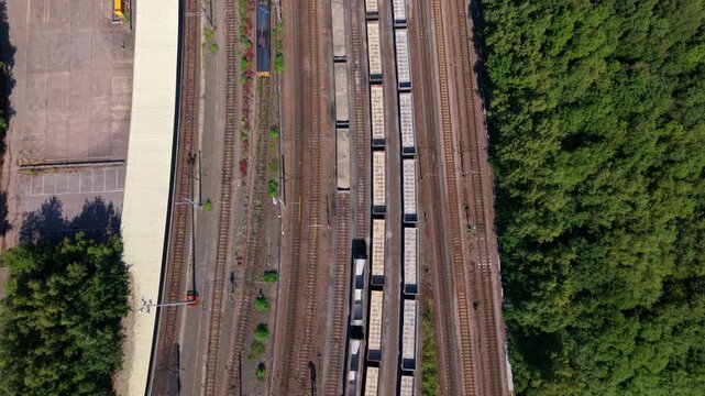 Close aerial view of a major railway junction and train maintenance yard in central Doncaster, UK