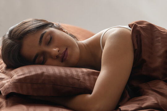 Close-up portrait of a beautiful young sleeping girl