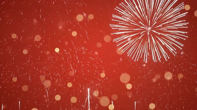 Bright white fireworks explode against a vibrant red background with soft glowing bokeh light effects