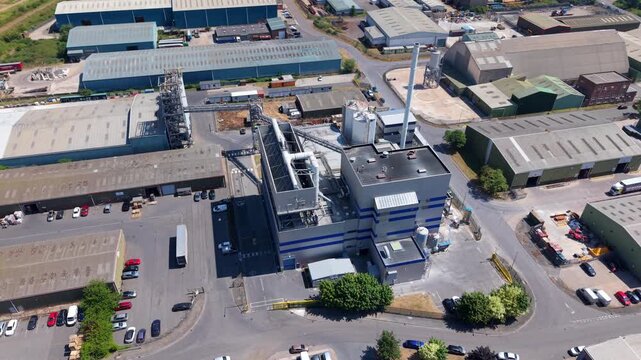 Close up aerial view of industrial biomass power plant with waste-to-energy conversion infrastructure