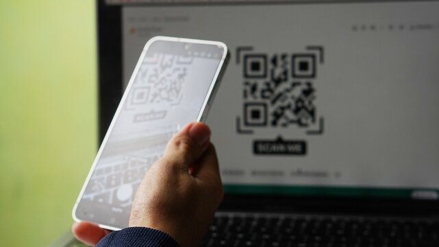 businessman using qr code at smartphone 