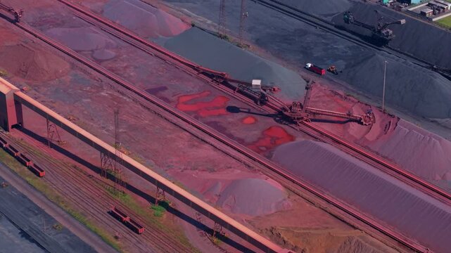 Aerial view of iron ore and coal stockpiles at the Port of Immingham bulk terminal in Lincolnshire, UK