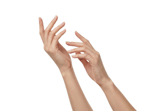 Graceful woman hands extended upward with delicate fingers.