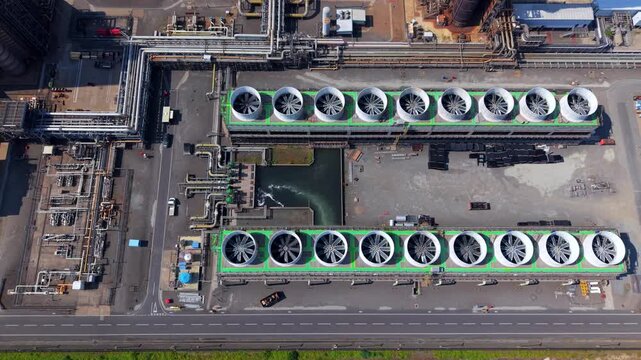 Close up aerial view of power station cooling towers with rows of forced draft ventilation fans