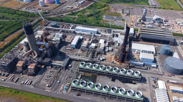 Close up aerial view of power station cooling towers with rows of forced draft ventilation fans