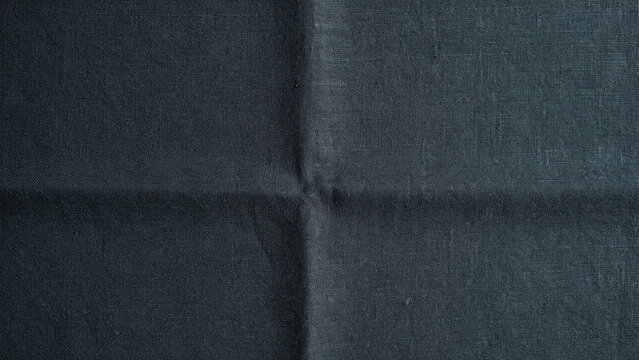 Close-up texture of dark charcoal gray fabric with a visible woven pattern, featuring a subtle ad social media download thambnail template event festive festival 2026 2027 2028