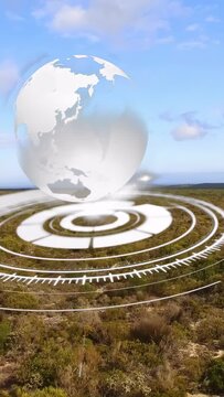 Vertical video: Rings pulsing on shrubs starting hologram, globe rising rotating showing continents