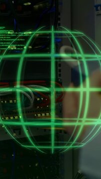 Vertical video: Tester nearing patch panel causing green globe while tech adjusting cables for test