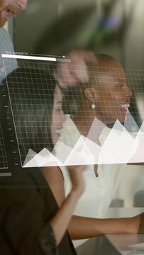 Vertical video: Woman tapping keys, holo data charts morphing into bars, map rising, team reviewing