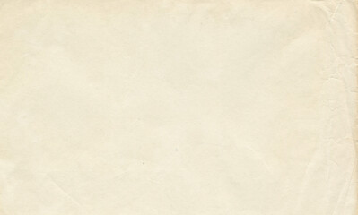Fototapeta premium Vintage old paper texture background. Empty beige page with aged material surface. Blank parchment scrap for historical document design or rustic stationery project. Retro textured sheet