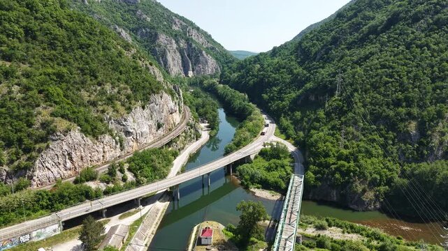 Drone Shot of Ovcar Banja, Serbia, Road and Bridge Traffic Above Zapadna Morava River