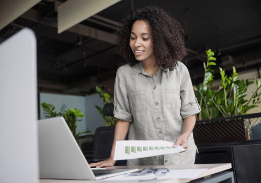 Young woman using laptop computer at office. Businesswoman working at modern office. Work or study online, freelance, casual business, office lifestyle concept	