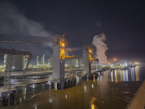 ilo terminal and industrial zone at night. smock and lights.